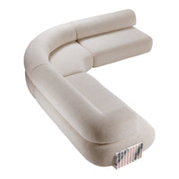 Curved beige sofa with a soft, textured fabric and a subtle, modern design, ideal for contemporary interiors.