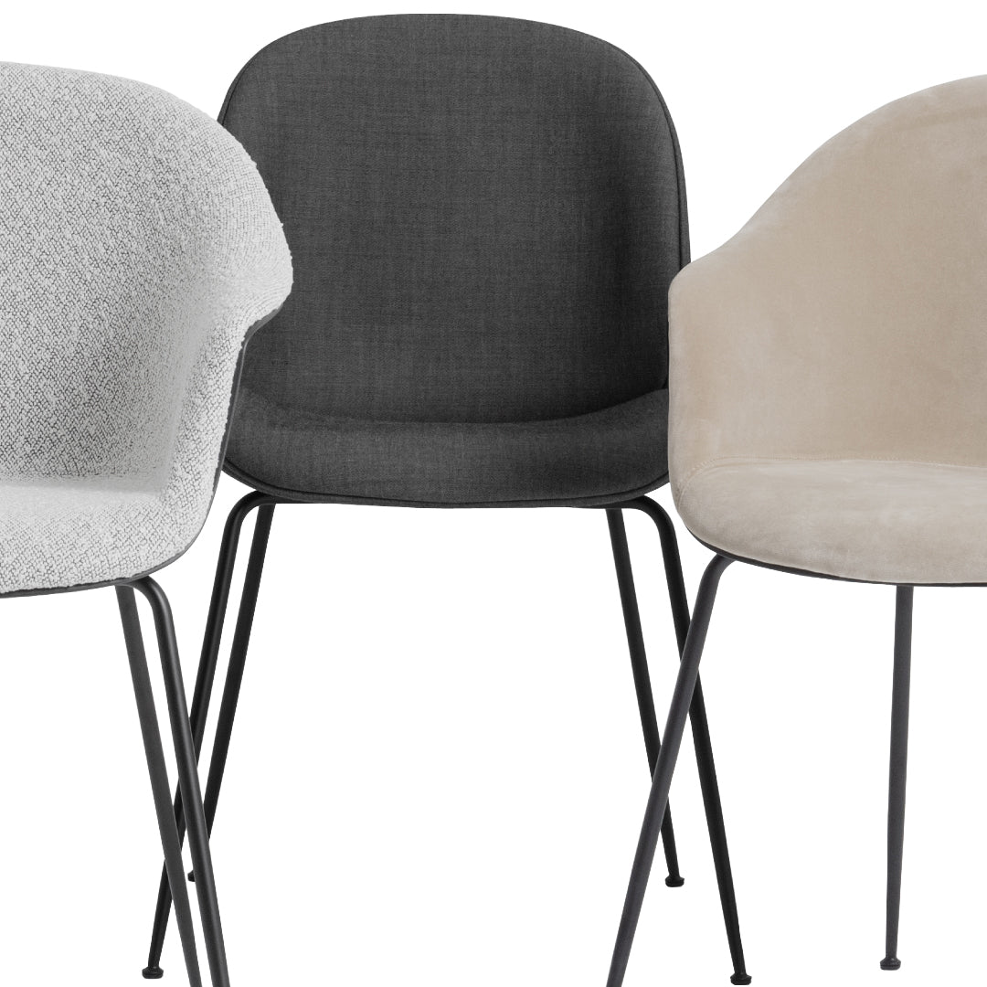 "Set of three modern chairs in light gray, dark gray, and beige upholstery with sleek black legs."