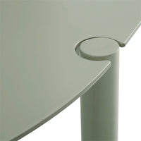 Light green circular table with smooth edges and a minimalist design, featuring a stylish connecting joint.