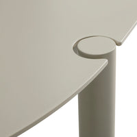 Light beige table surface with smooth curves and a circular joint detail, perfect for modern decor.