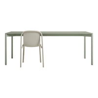 Minimalist green desk paired with a light beige chair, showcasing a modern, sleek design.