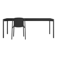 Sleek black desk with a matching black chair, featuring minimalist design and modern aesthetic.