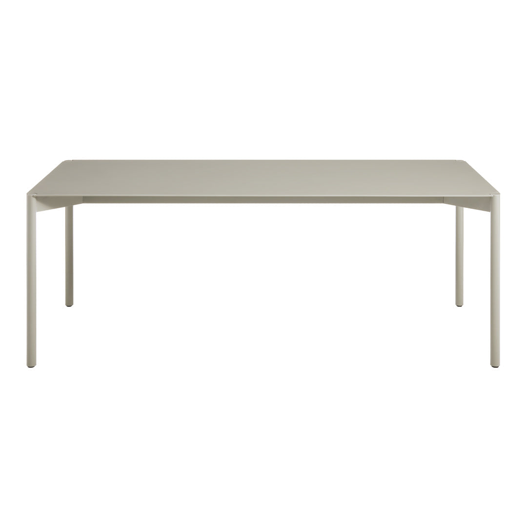 Modern rectangular dining table in soft taupe with a sleek, minimalistic design and smooth surface.