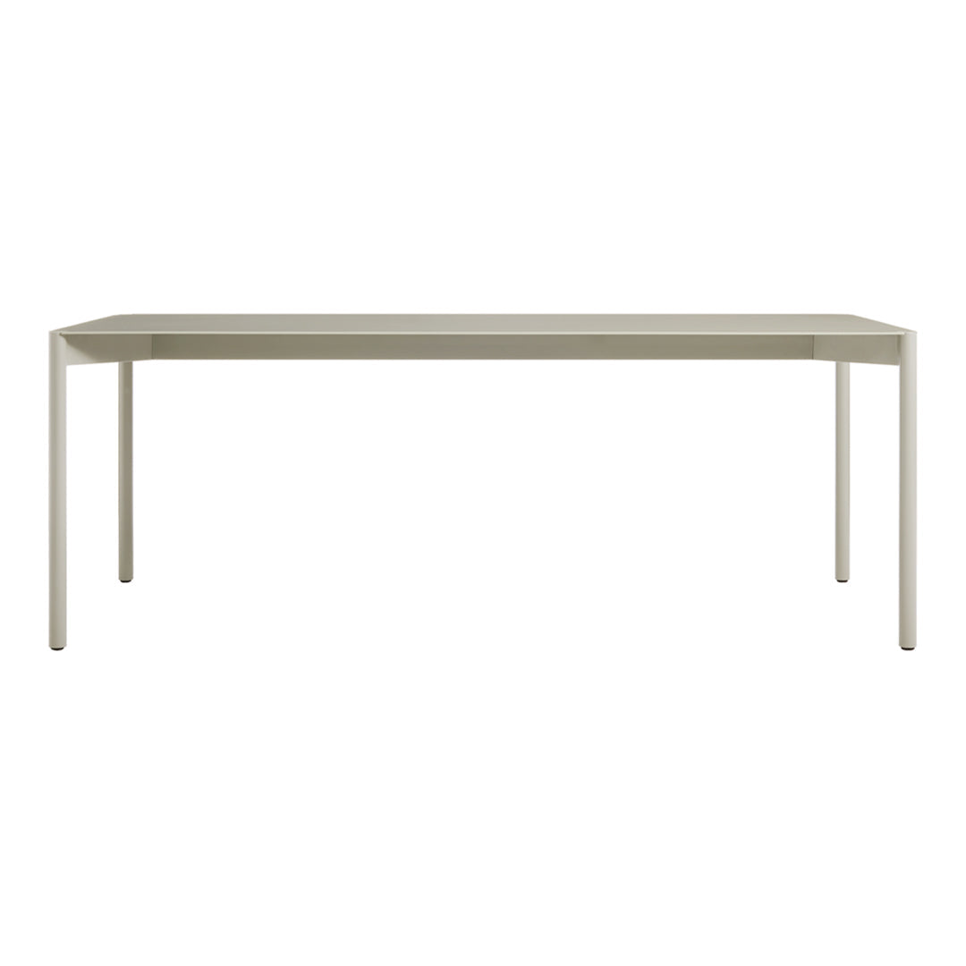 Neutral-colored rectangular table with a smooth surface and minimalist design. Perfect for modern decor.