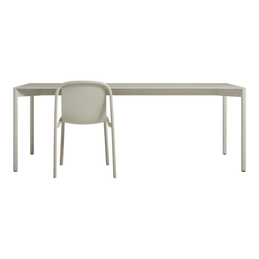 Light gray modern desk with a matching minimalist chair, featuring smooth lines and a contemporary design.