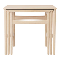 Light oak nested tables with a minimalist design, featuring smooth, natural wood grain and clean lines.