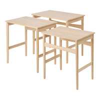 Natural wood finish nesting tables with a light, simplistic design. No patterns; versatile for any decor style.