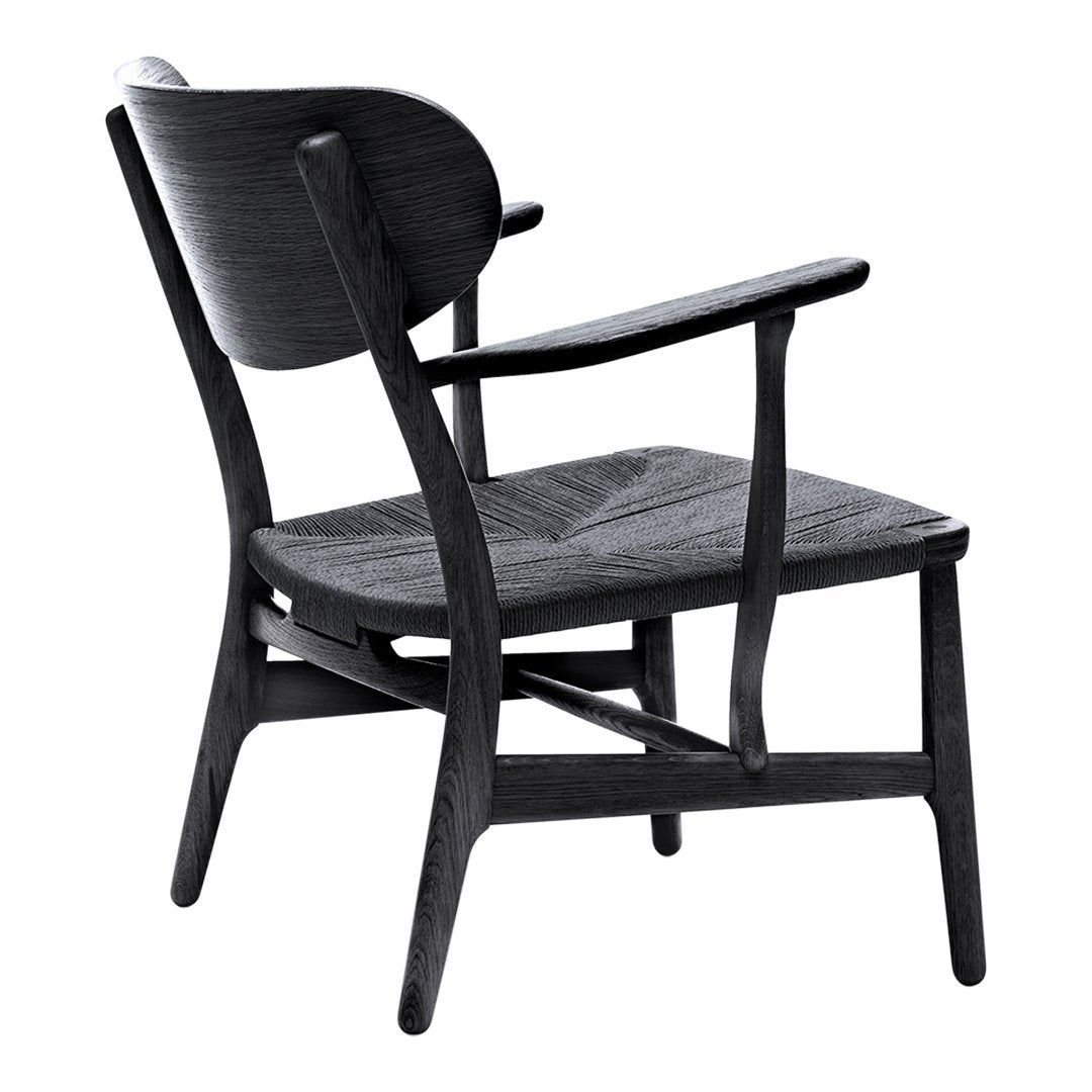 Black wooden chair with smooth lines and a minimalist design, featuring a natural wood grain pattern.