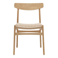 Light oak wood chair with a woven natural fiber seat and simple minimalist design.