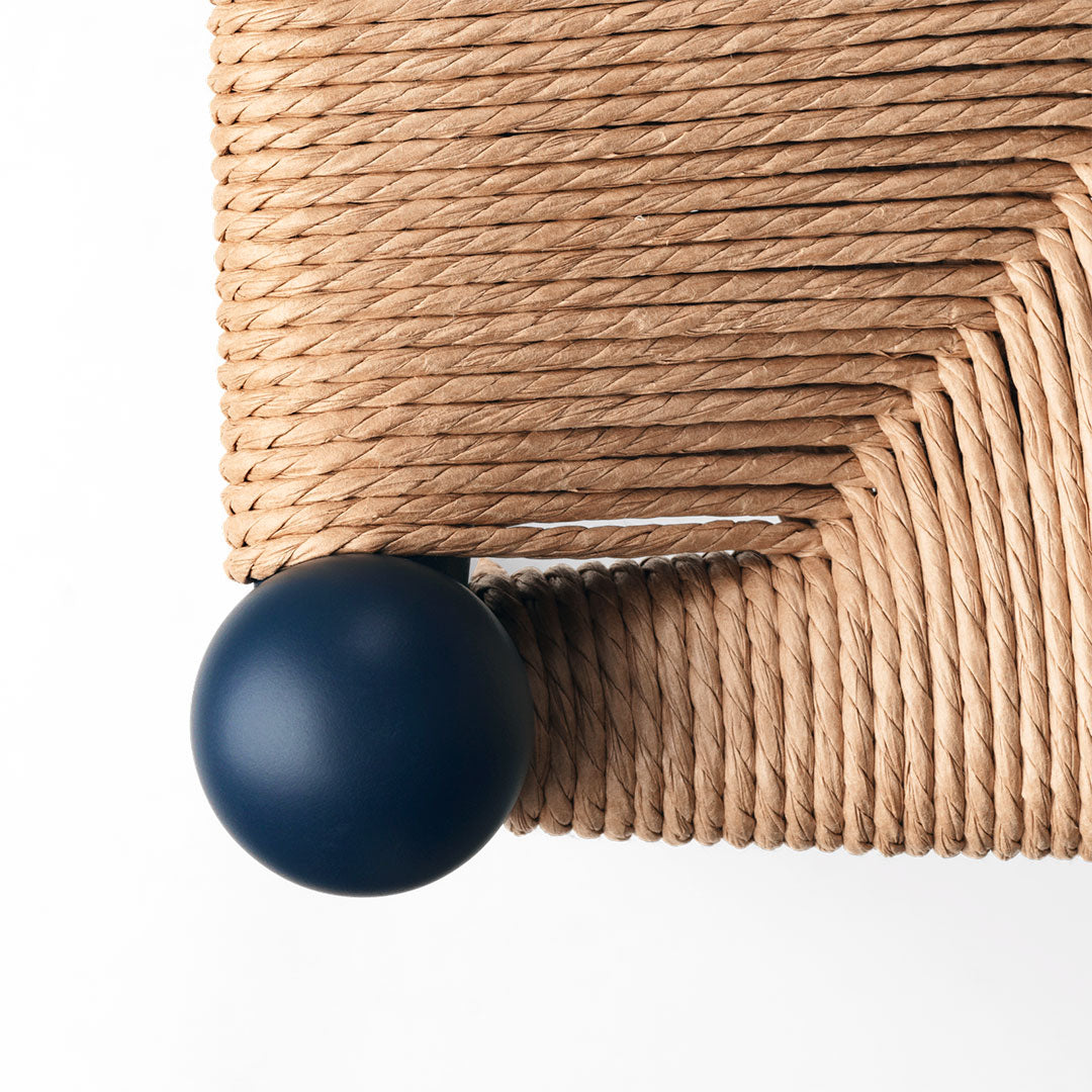 Natural beige rope texture with a dark blue spherical accent. Modern, stylish design with distinctive geometric pattern.