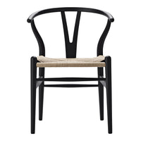 Black wooden chair with a minimalist design and natural woven seat. Perfect blend of modern and classic aesthetics.