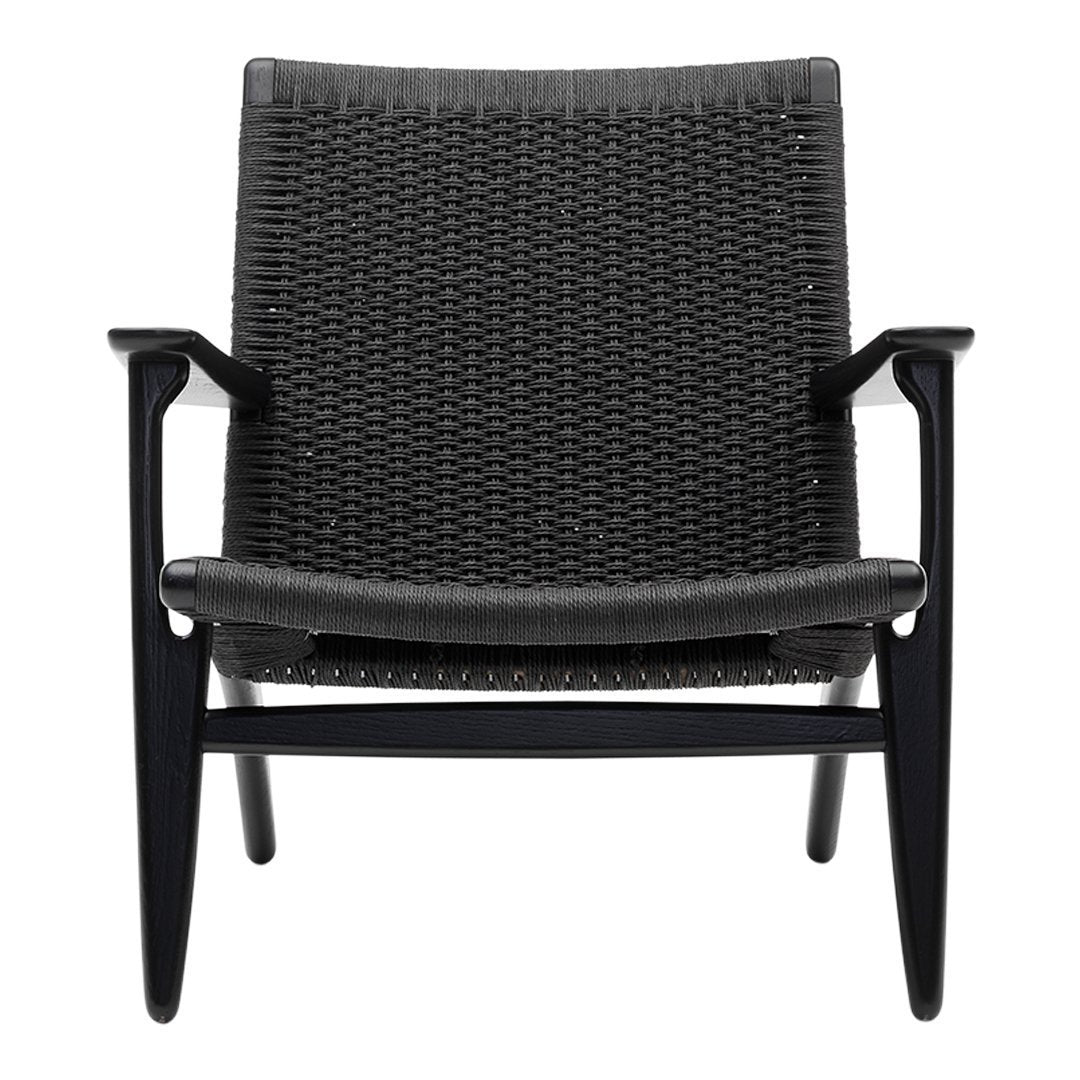 Black woven chair with a sleek design and contrasting light gray cushions, featuring a minimalist pattern.