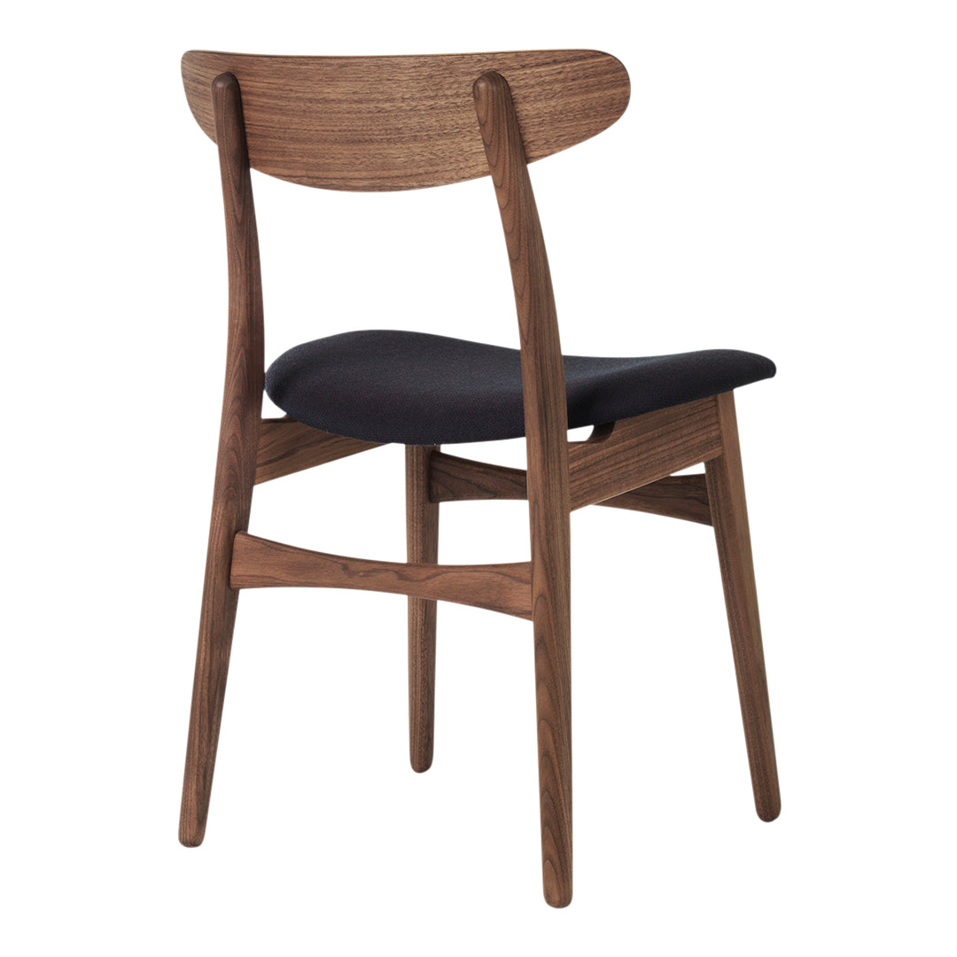 Wooden chair with a dark walnut finish and a sleek black seat, featuring a minimalist design and smooth lines.