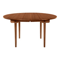 Round wooden table in warm walnut finish with a smooth, natural grain pattern. Ideal for modern dining spaces.