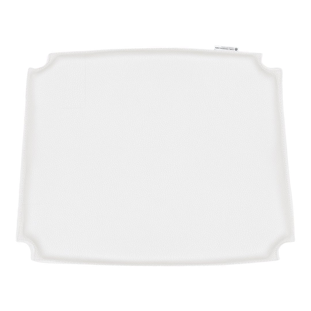 Elegant white rectangular placemat with subtle scalloped edges, perfect for any dining setting.