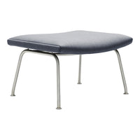 Stylish gray ottoman with a smooth upholstered surface and sleek metallic legs. Perfect for modern decor.