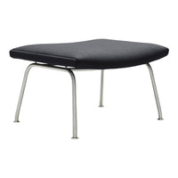 Black upholstered ottoman with a sleek design and silver metal legs. Modern minimalist style for any decor.