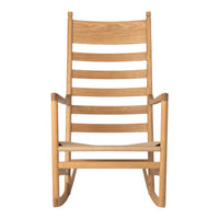 Natural oak rocking chair with a sleek, minimalist design and horizontal slat pattern. Perfect for a cozy aesthetic.