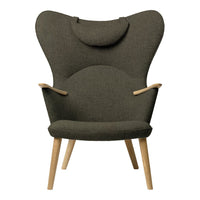 Dark olive green upholstered chair with a smooth, minimalist design and natural wood legs. Simple, modern patterns.