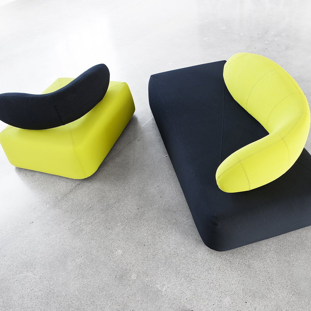Modern two-piece sofa set featuring bold yellow and black colors with unique curved shapes for a contemporary look.
