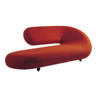 Sleek, modern orange curved sofa with a smooth texture and minimalist design, ideal for contemporary decor.