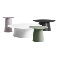 Set of four modern side tables in white, green, black, and lilac with sleek, clean lines and minimalist designs.
