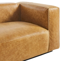 Tan leather sofa with a smooth texture and minimalist design, featuring a subtle, rustic appearance.