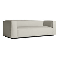 Minimalist cream sofa with a solid color design and sleek lines, featuring a modern, structured shape.