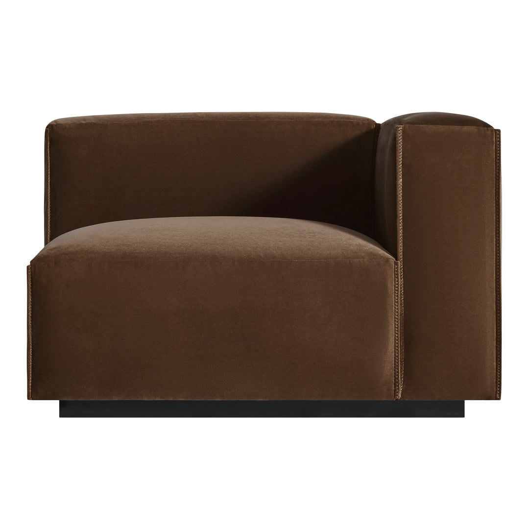Brown velvet armchair with a minimalist design and smooth, sleek finish. Perfect for modern interiors.