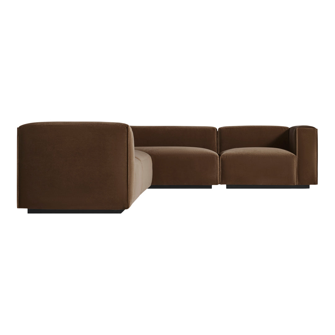 Brown sectional sofa with a smooth, seamless design; casual elegance perfect for contemporary spaces.