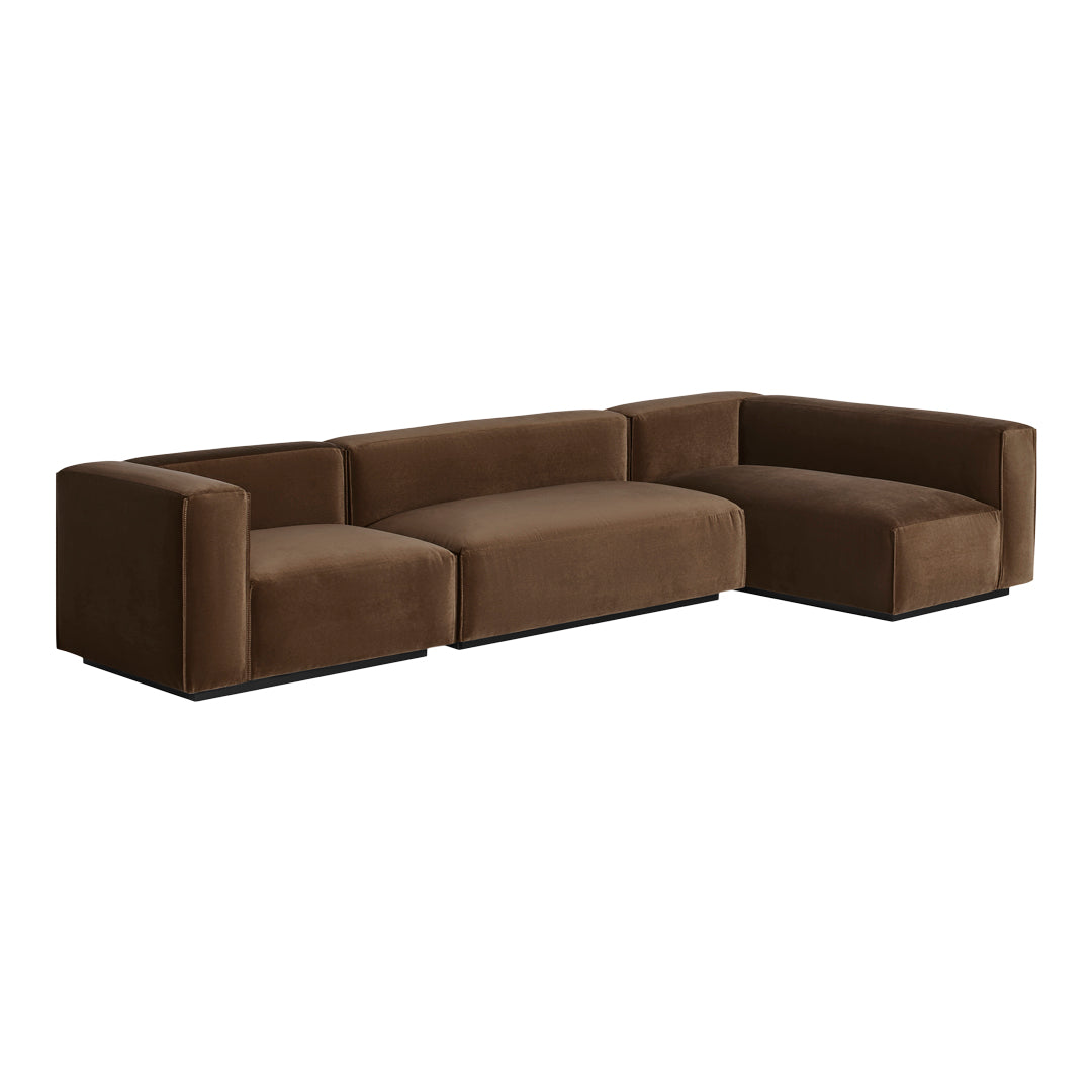 Brown velvet sectional sofa with a modern, minimalist design and clean lines, perfect for contemporary interiors.