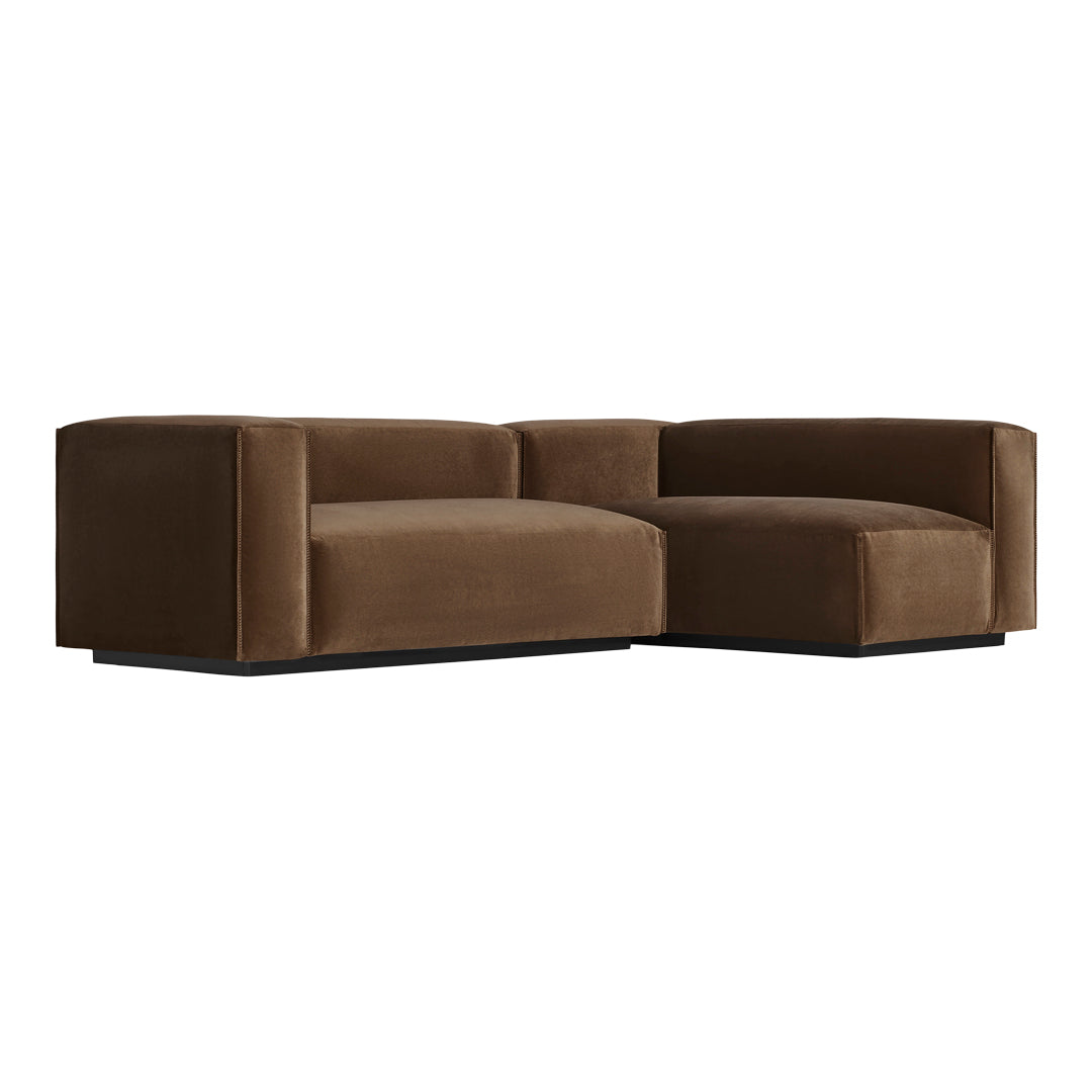 Brown velvet sectional sofa with a modern, sleek design and solid color upholstery. Ideal for contemporary spaces.