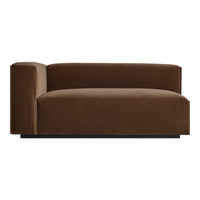 Dark brown velvet chaise lounge with a smooth, solid pattern and modern silhouette. Perfect for contemporary spaces.