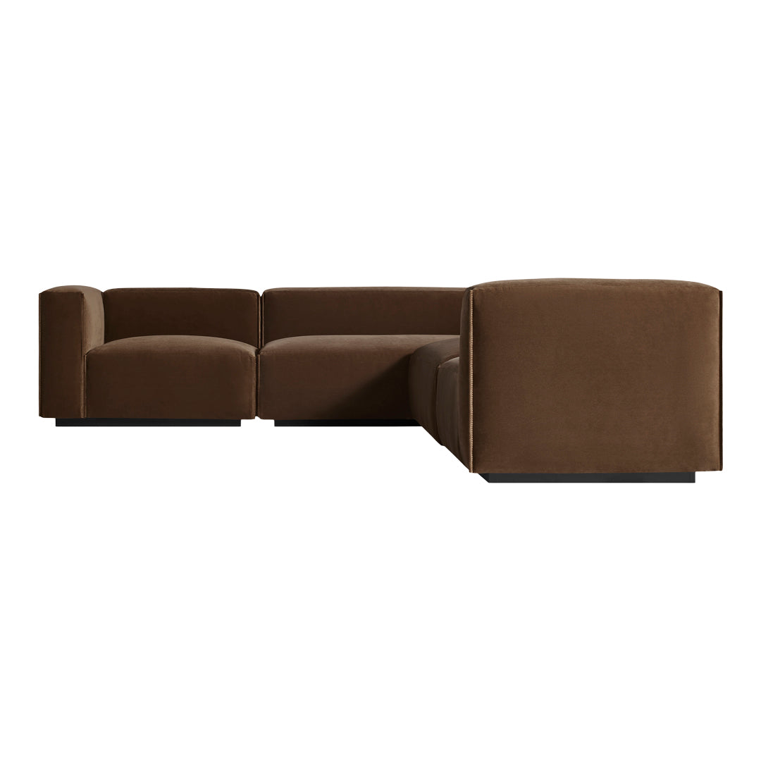 Brown sectional sofa with a smooth, minimalist design, featuring solid, rich tones and clean lines. Perfect for modern decor.