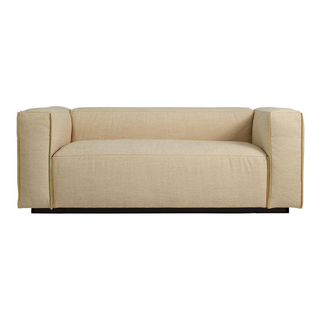 Beige minimalist sofa with a smooth texture and clean lines, ideal for modern interior decor.