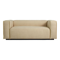 Beige minimalist sofa with a smooth texture and clean lines, ideal for modern interior decor.