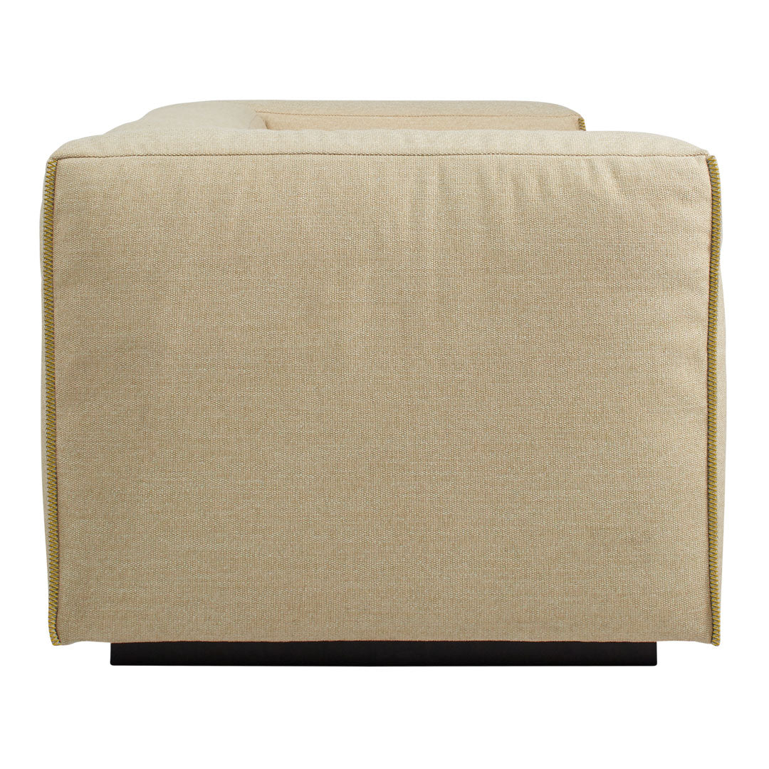 Beige upholstered sofa with a smooth, minimalist design and contrasting dark wood legs. Perfect for modern interiors.