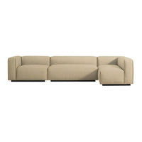 Beige sectional sofa with a minimalist design, featuring soft, smooth upholstery and sleek black base.