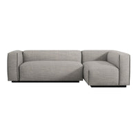 Gray sectional sofa with a sleek, modern design and textured fabric, featuring a minimalist pattern and clean lines.