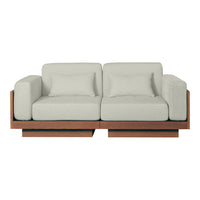 Light gray couch with a minimalist design and dark wooden accents, featuring a modern, clean aesthetic.