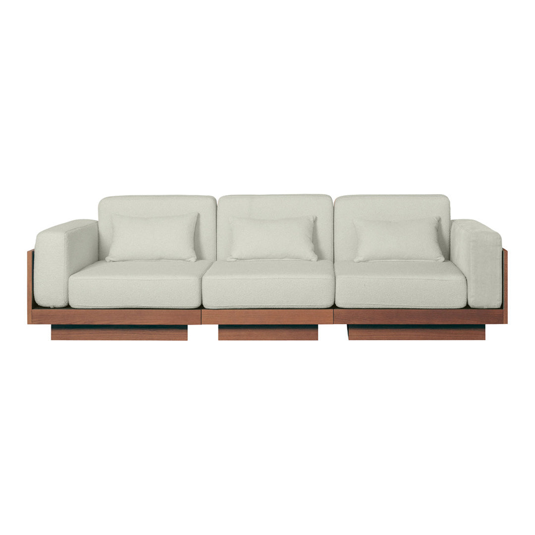 Light beige cushions with a smooth texture on a wooden base in warm brown tones. Modern and minimalist design.