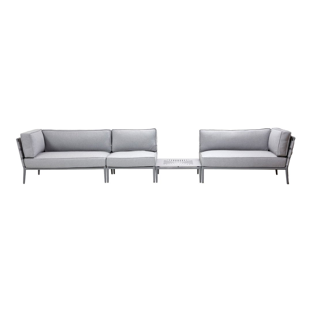 Modern gray outdoor sofa set with sleek metal frames and light gray cushions, featuring a minimalist design.