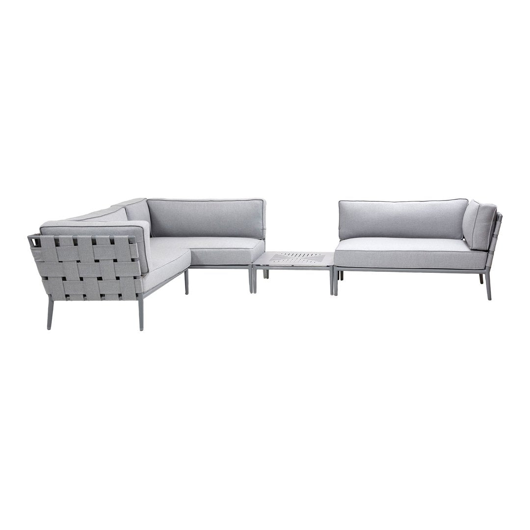 Gray sectional sofa with a modern design featuring soft fabric and sleek metallic accents. Ideal for contemporary spaces.