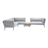 Gray outdoor sectional sofa with textured fabric and wooden coffee table. Modern and minimalist design perfect for patios.