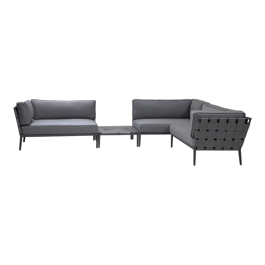 Gray modular outdoor sofa set with sleek lines and geometric patterns, featuring a mix of solid and perforated materials.
