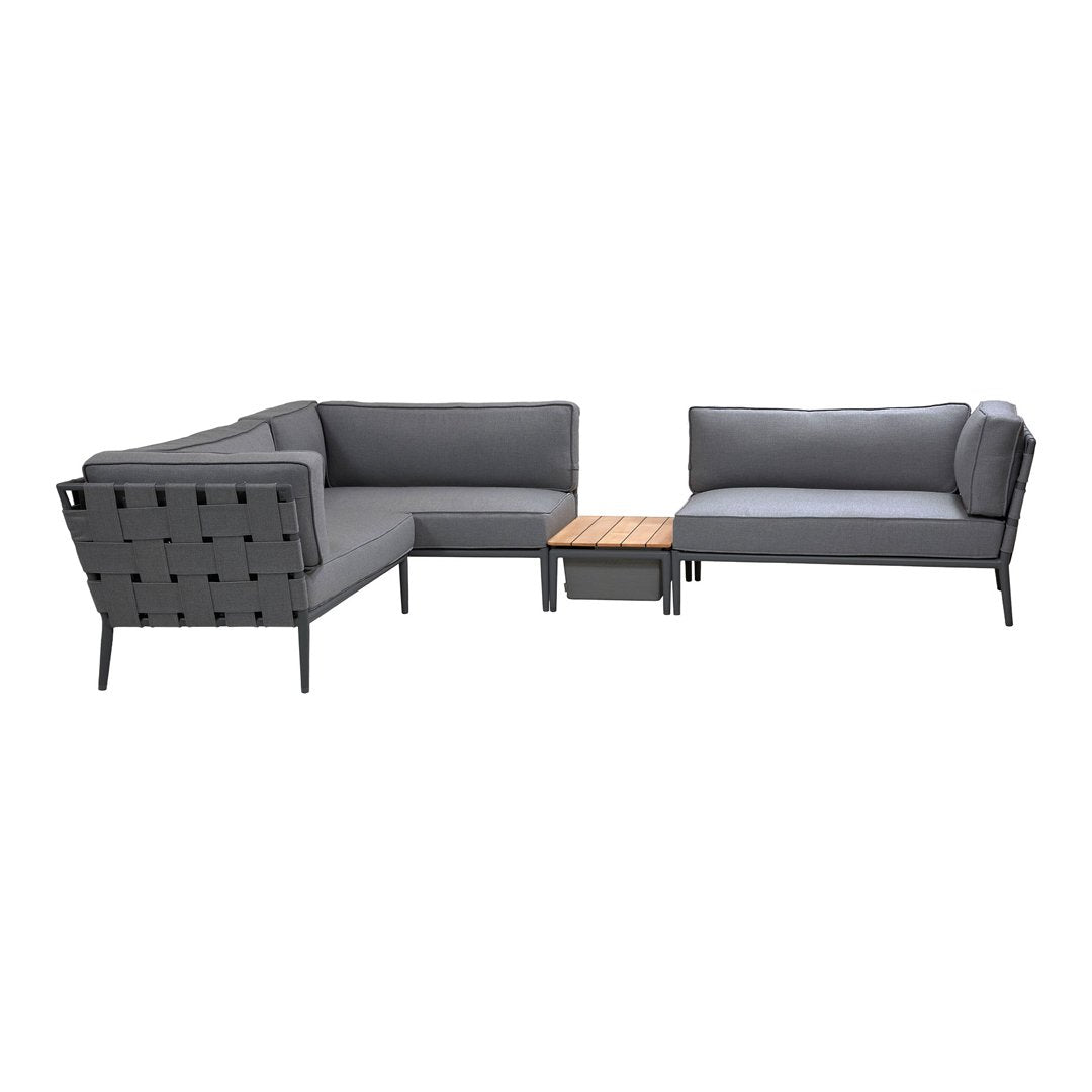 Modern outdoor sectional sofa in dark gray with sleek lines and a natural wood coffee table. Stylish and contemporary design.