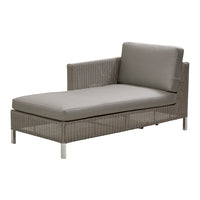 Gray wicker chaise lounge with smooth, soft cushions in muted gray tones. Ideal for modern outdoor spaces.