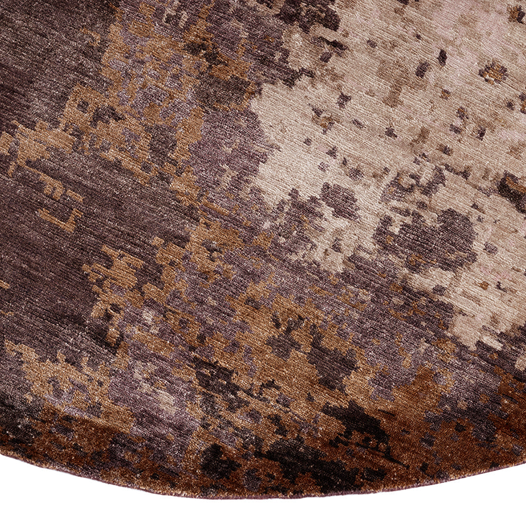 Textured area rug featuring rich shades of brown, beige, and subtle abstract patterns. Ideal for stylish interiors.