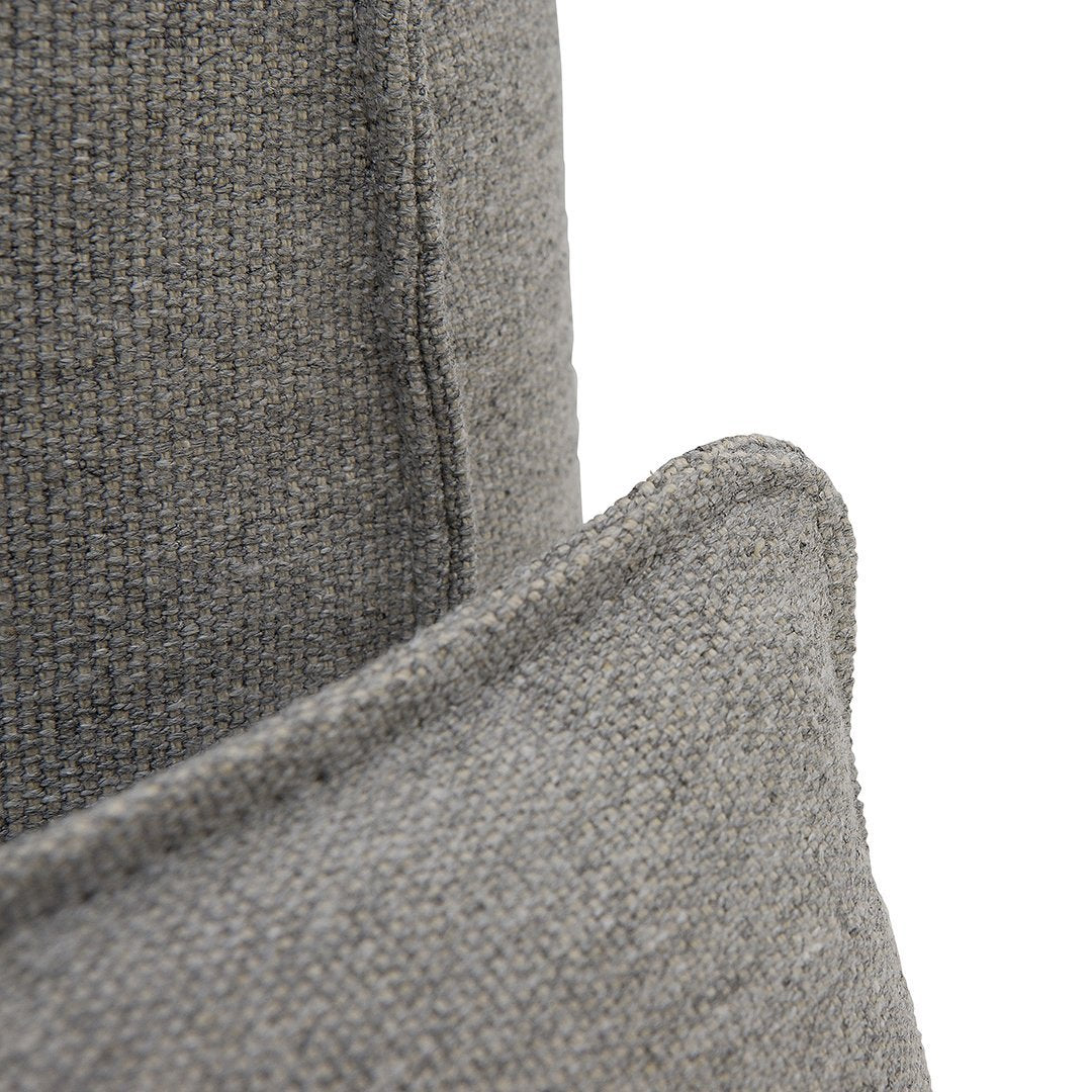 Close-up of textured gray fabric with a subtle weave pattern, highlighting a modern, sophisticated design.