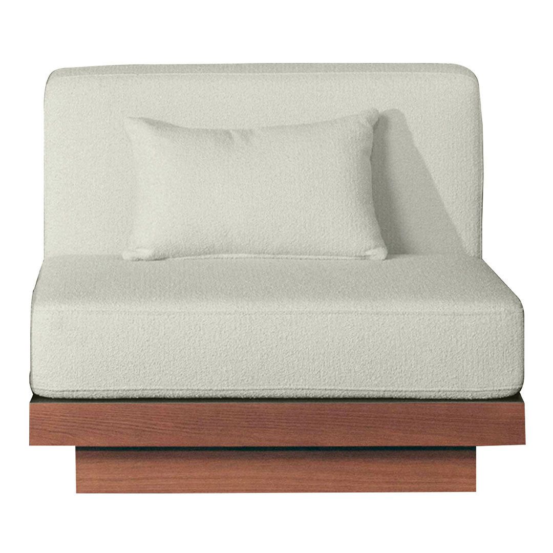 Light gray upholstered chair with a matching accent pillow and a sleek wooden base, showcasing a minimalist design.